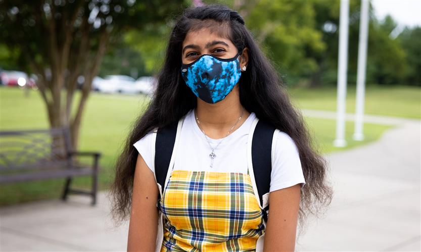 A girl wearing a mask